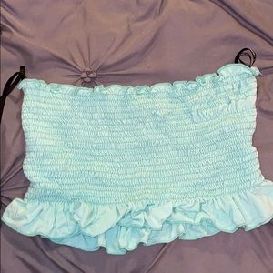 Cropped tube top with ruffles at the bottom
